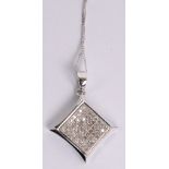 A 9ct white gold fine link chain supporting a 9ct diamond encrusted shaped square section pendant,