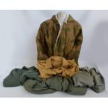 Five jackets including a Hamnett example, a camouflage example, a sand coloured example,