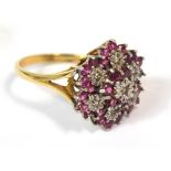 A 9ct gold floral set dress ring with pink sapphires and white stones, size P, approx 4.6g.