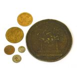 A bronze Voltaire medallion and a small quantity of Victorian coins/tokens.