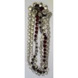 A 1950s Christian Dior three strand red and white rhinestone dress necklace.