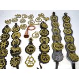 A quantity of horse brasses and further metalware.