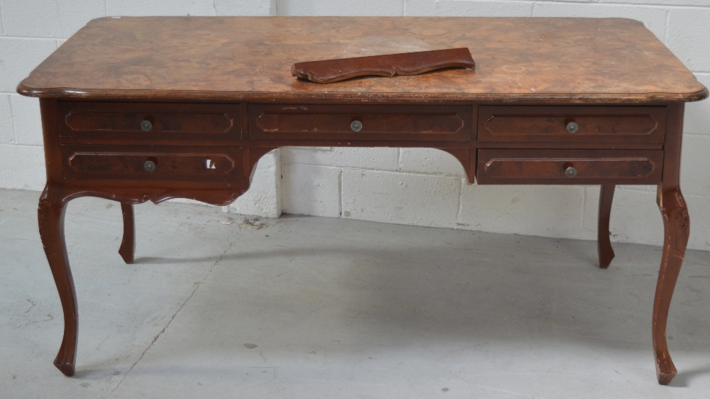 A 20th century walnut writing desk of rectangular form, length approx 160cm (af).