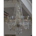 An amber and clear crystal eight branch chandelier.