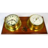 A brass ship's clock with circular dial inscribed 'Chadburn Liverpool' and a Cope of Nottingham