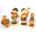 Four Hummel figures to include three musicians; a young boy playing a lute, one playing a violin,