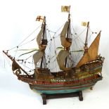 A scratch built scale model of a ship 'Golden Hind' on accompanying stand, length approx 70cm.