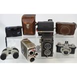 A cased Rolleicord camera, a cased Kodak 35 camera plus various other cameras etc.