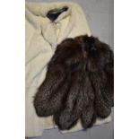 A 1930s fox fur cape and a 1930s white fur full-length cape (lacking lining) (2).
