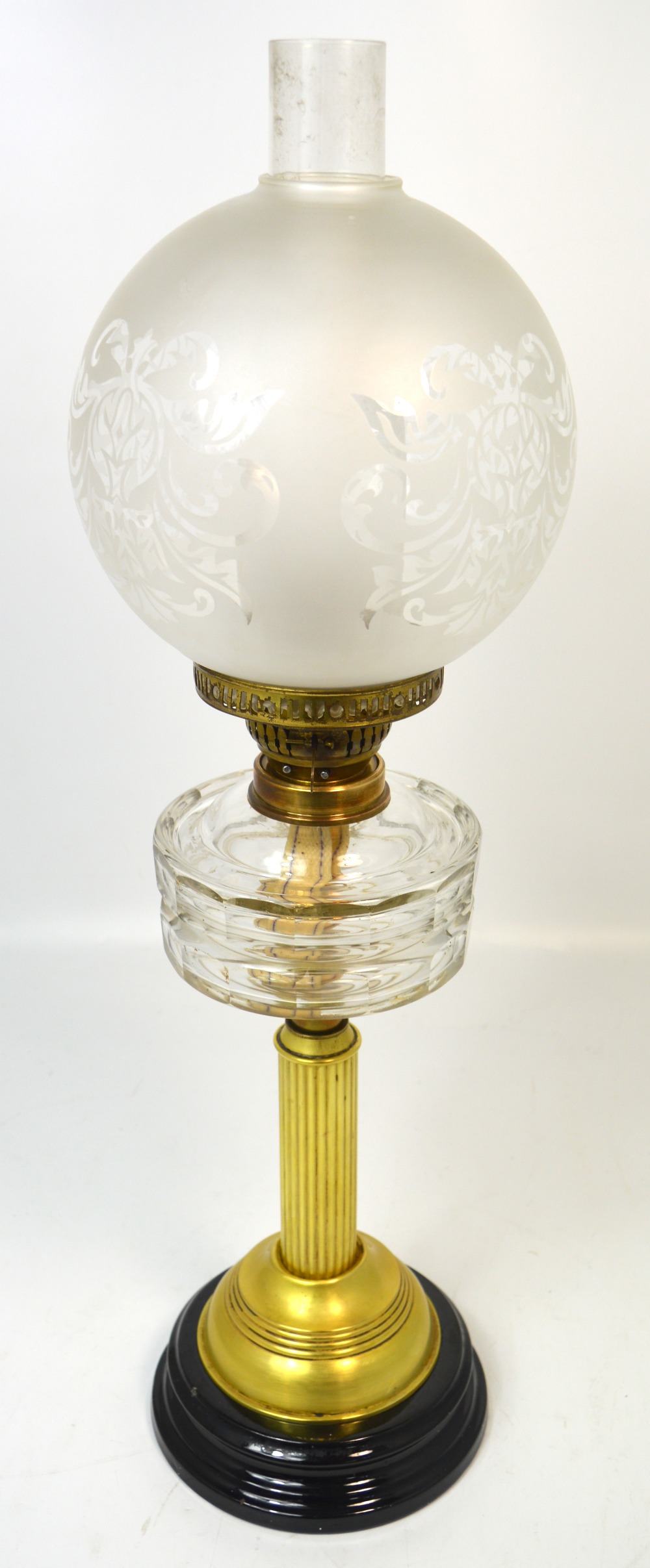A Victorian brass oil lamp with facet cut glass font,