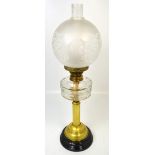 A Victorian brass oil lamp with facet cut glass font,