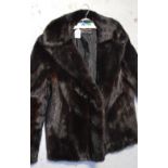 A vintage chocolate brown waist-length mink jacket with label to interior,