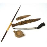 A group of antiquities to include an adze spike, a dagger with leather sheath,