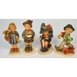 Four Hummel figures to include a young girl holding a trumpet and a flowerpot,