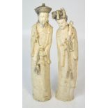 A pair of early 20th century Chinese carved ivory figures,
