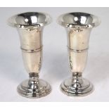 A pair of Elizabeth II hallmarked silver matched loaded trumpet vases, height of both 13cm, one af.