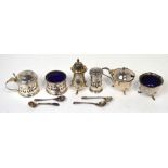 A George V hallmarked silver three piece cruet set,