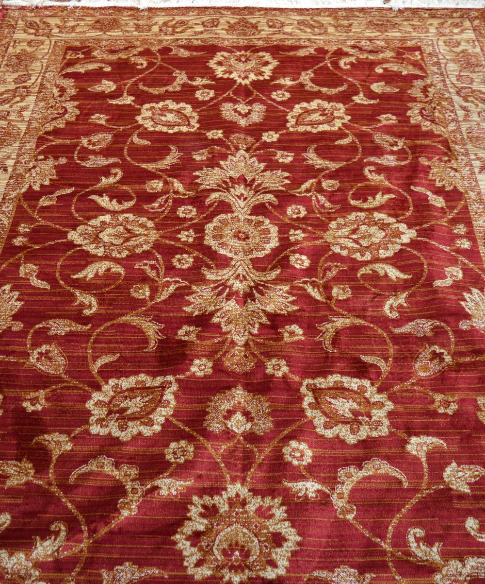A red ground Zeigler style carpet, 230 x 160cm.