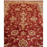 A red ground Zeigler style carpet, 230 x 160cm.