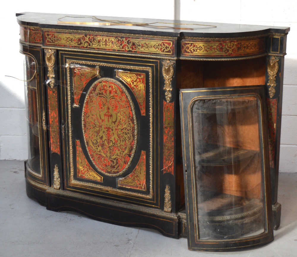 A 19th century ebonised and boulle work credenza, the shaped top above foliate detailed freeze,