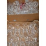 A large quantity of cut glass including large wine glasses, liqueur glasses etc.