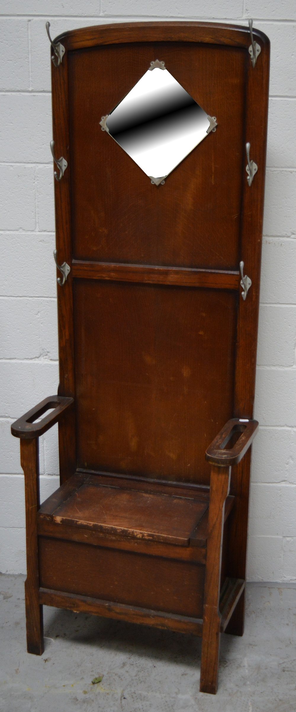 A mid 20th century oak hall stand and an oak stick and umbrella stand (2).