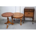 A mid 20th century round walnut side table on cabriole legs and paw feet,