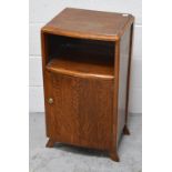 A leather topped side table on a tripod base,