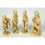 Four small Japanese Meiji period carved ivory okimono, each depicting a gentleman,