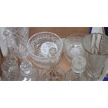 A quantity of cut glass including a large trumpet shaped vase, four decanters, two bowls etc.