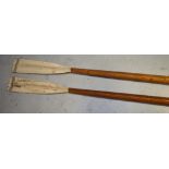 A pair of E. Ayling & Sons of Putney London rowing oars, approx length 10' (296cm).