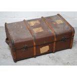 A 19th century travelling chest with bamboo supports and paper labels.