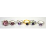 Six gem set silver and silver gilt rings including one set with a star sapphire cabochon (6).