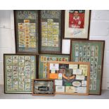 Five sets of framed and glazed cigarette cards depicting fish, butterflies and birds,