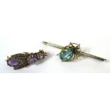 A silver gilt bar brooch with a central spider set with blue stones and a white metal fly brooch
