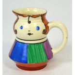 A rare Wilkinson 'Boy Blue' milk jug with striped body and brown curly hair,