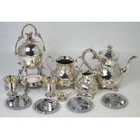 A quantity of silver plated items to include a three piece tea service, an egg coddler etc.