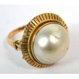 A 14ct gold dress ring with simulated pearl, size P, approx 12.2g.