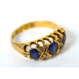 An 18ct gold sapphire and diamond ring in high pierced claw setting, size L1/2, approx 4g.