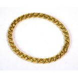 A 9ct gold hinged bangle with rope twist design, approx 19g.