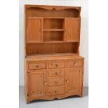 A modern pine dresser of small proportions, width 113cm.