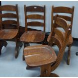 A set of four oak country style dining chairs.