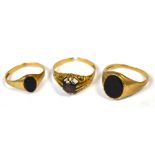 Three 9ct gold rings, two gentlemen's dress rings, one set with onyx and one with a red stone,