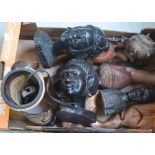 A quantity of various carved figures to include African heads, elephants,