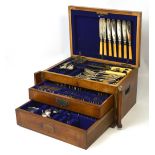 A near complete oak cased canteen of matched silver-plated cutlery and a further quantity of loose