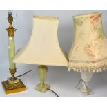 An early 20th century standard lamp with reeded column and floral shade,