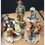 A Capodimonte figure of an elderly man and two other similar examples (3).