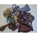A collection of vintage designer ties to include Yves Saint Laurent, Christian Dior, Pierre Cardin,
