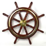 A brass mounted hardwood ship's wheel with eight baluster turned spokes,