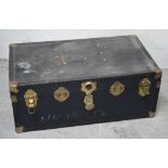 A vintage black metal-bound travelling chest.